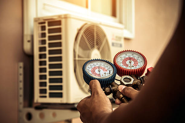 Professional Air Conditioning Service technician working in Templeton, IN